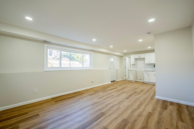 unfurnished living room featuring light hardwood / wood-style flooring