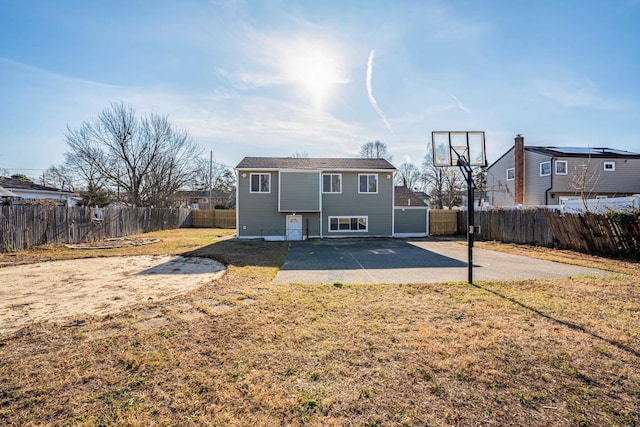 back of property featuring a yard and a patio