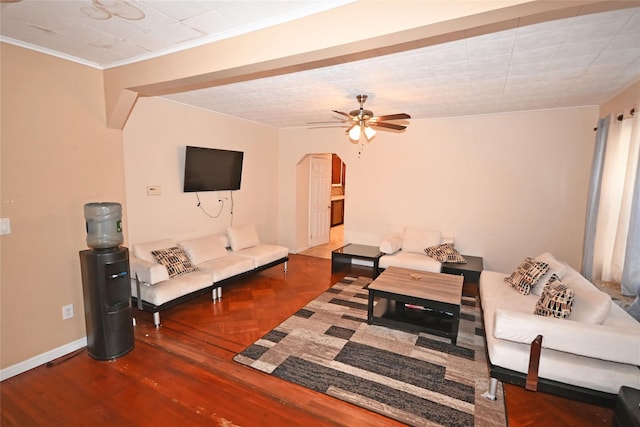 living room with crown molding and ceiling fan