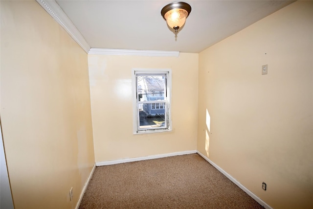 unfurnished room featuring carpet and crown molding