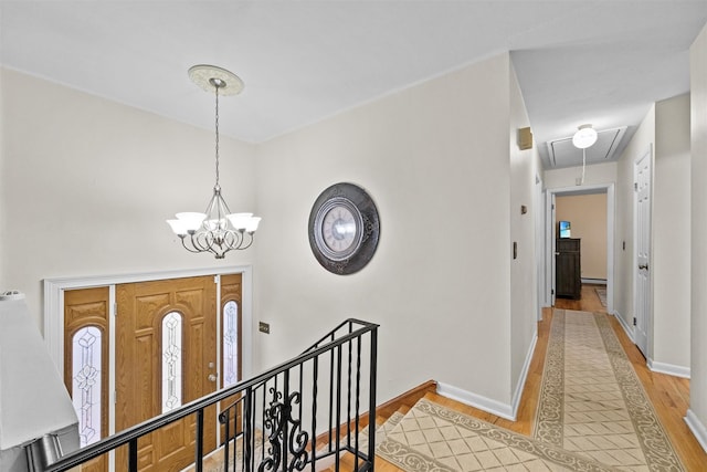 entryway featuring a chandelier and light wood-type flooring