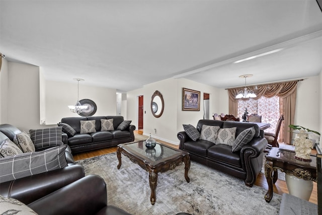 living room featuring hardwood / wood-style floors and an inviting chandelier