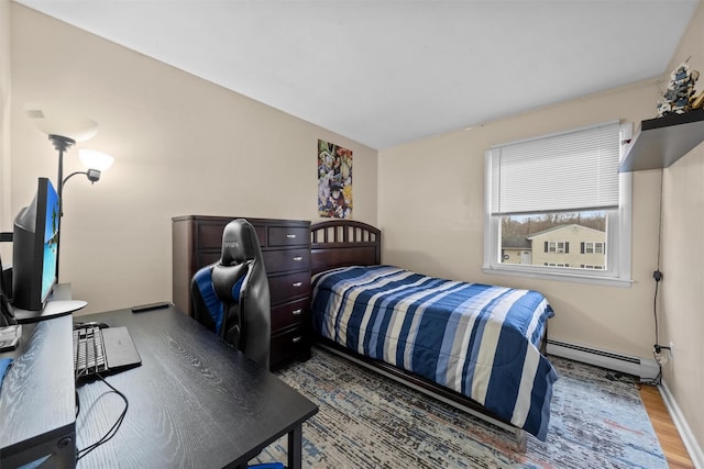 bedroom featuring a baseboard radiator and dark hardwood / wood-style floors