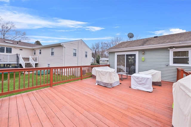 deck featuring area for grilling and a yard