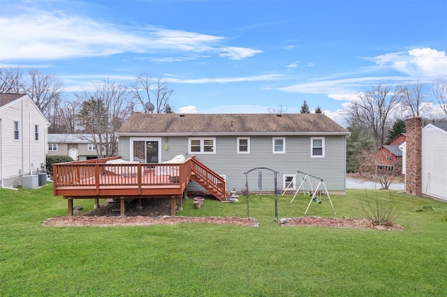 rear view of property with central AC, a lawn, and a wooden deck