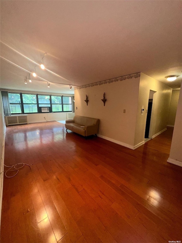 unfurnished living room with hardwood / wood-style flooring