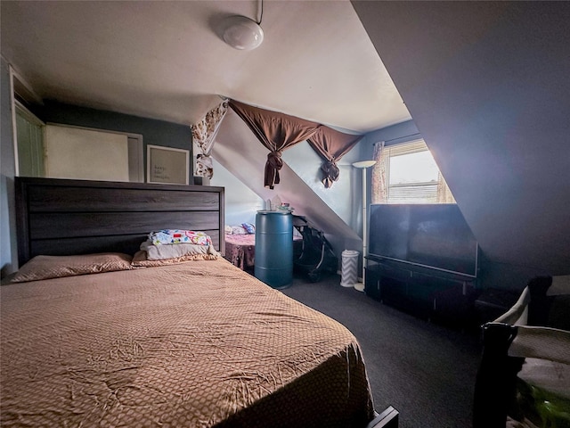 carpeted bedroom with vaulted ceiling