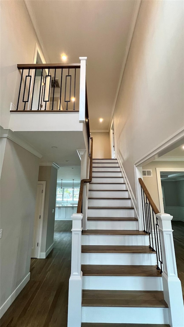 57 William St, Bethpage, NY 11714 - stairs with wood finished floors and crown molding