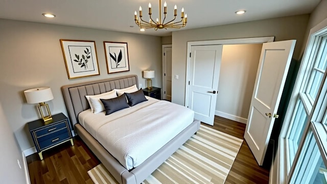 57 William St, Bethpage, NY 11714 - bedroom featuring a chandelier, dark wood-type flooring, and recessed lighting