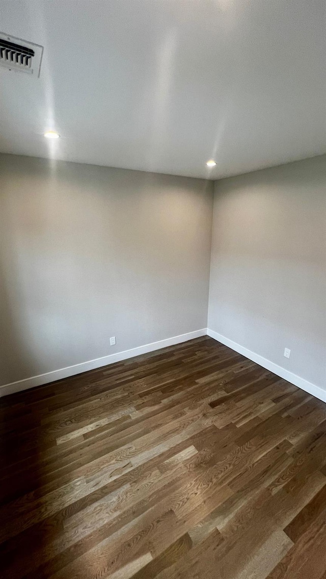57 William St, Bethpage, NY 11714 - spare room featuring dark wood-style floors and recessed lighting