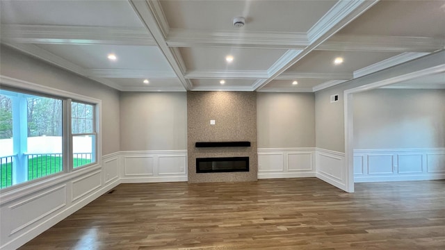 57 William St, Bethpage, NY 11714 - unfurnished living room featuring wood finished floors, a decorative wall, recessed lighting, a large fireplace, and beamed ceiling