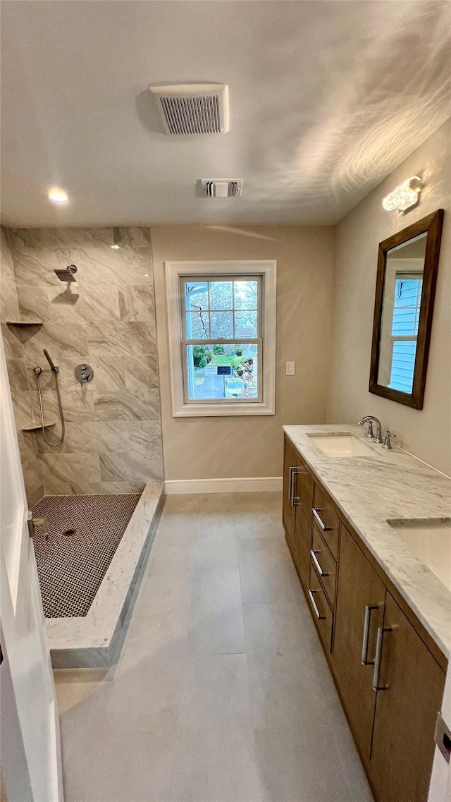 57 William St, Bethpage, NY 11714 - full bathroom with a tile shower, double vanity, and tile patterned flooring