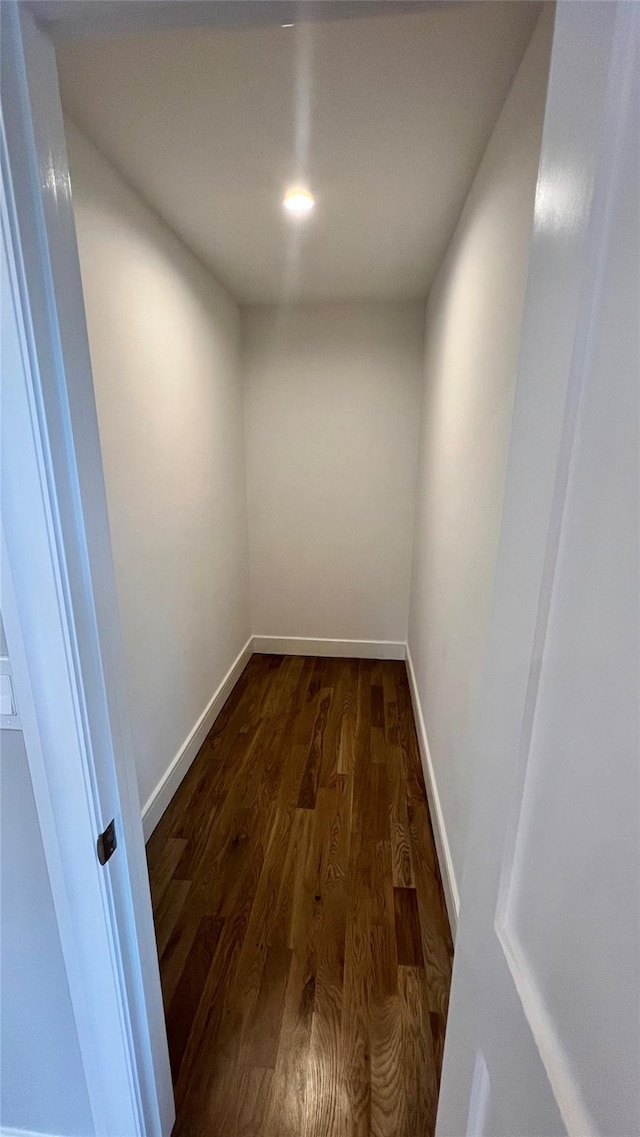 57 William St, Bethpage, NY 11714 - empty room with dark wood finished floors and baseboards