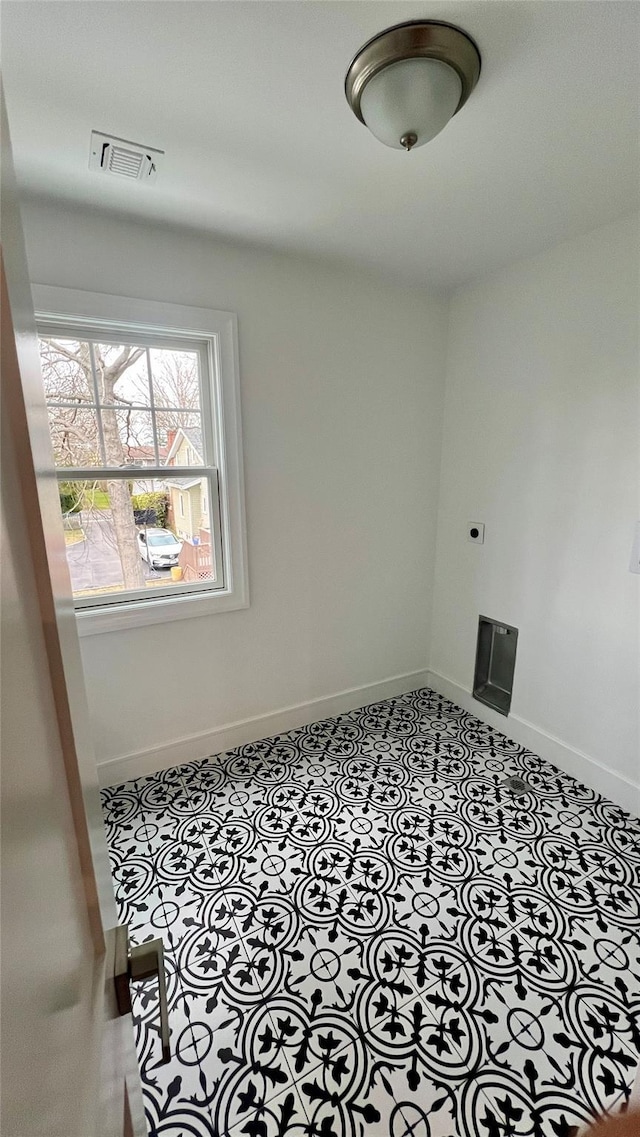 57 William St, Bethpage, NY 11714 - tiled spare room with baseboards
