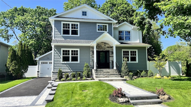 57 William St, Bethpage, NY 11714 - view of front facade featuring a garage, stone siding, and driveway