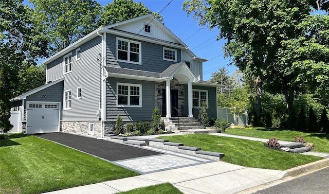 57 William St, Bethpage, NY 11714 - view of front of property featuring stone siding, a garage, a front lawn, and asphalt driveway