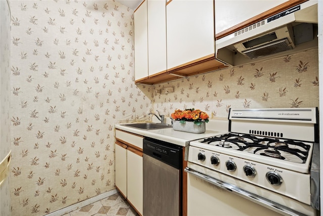 kitchen with sink, white range with gas stovetop, stainless steel dishwasher, extractor fan, and white cabinets