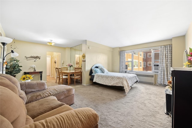 bedroom featuring carpet and radiator heating unit