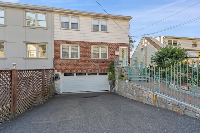 view of front of home with a garage