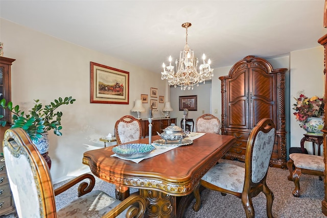 carpeted dining area featuring a chandelier