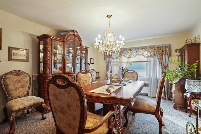 carpeted dining area featuring a notable chandelier