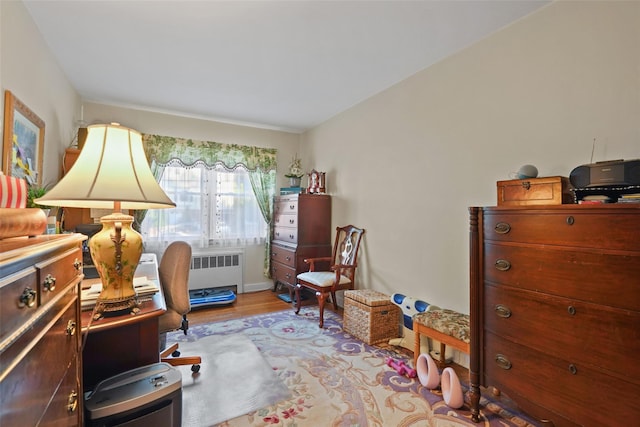 sitting room featuring light hardwood / wood-style floors and radiator