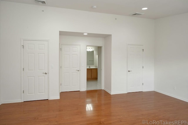 spare room with hardwood / wood-style flooring