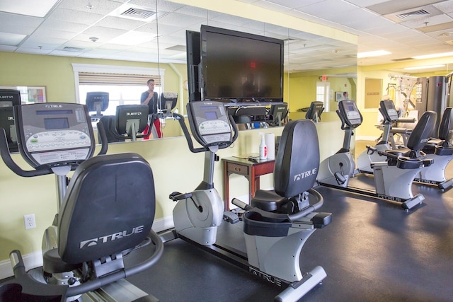 workout area with a paneled ceiling