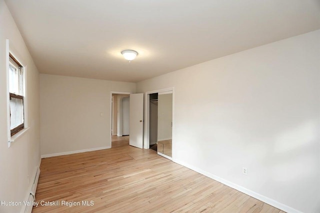 spare room featuring light hardwood / wood-style flooring