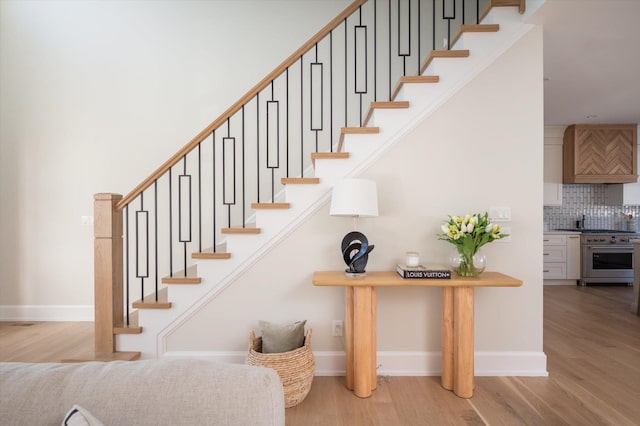 stairs featuring wood-type flooring