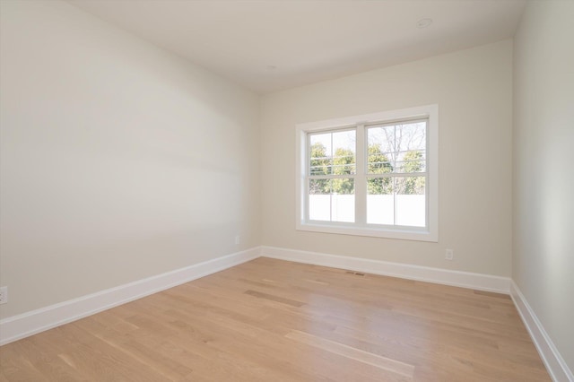 empty room with light wood-type flooring