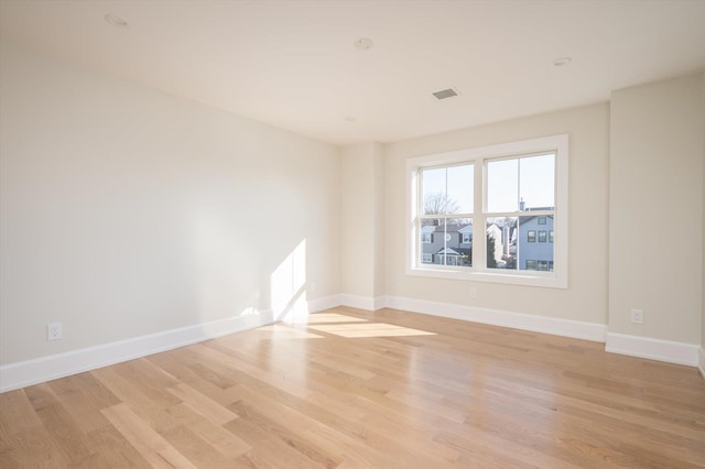 unfurnished room featuring light wood-type flooring