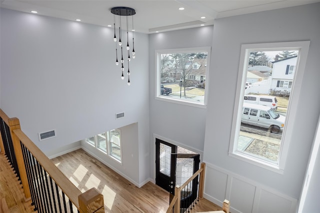 entrance foyer with stairs, light wood-style flooring, visible vents, and recessed lighting