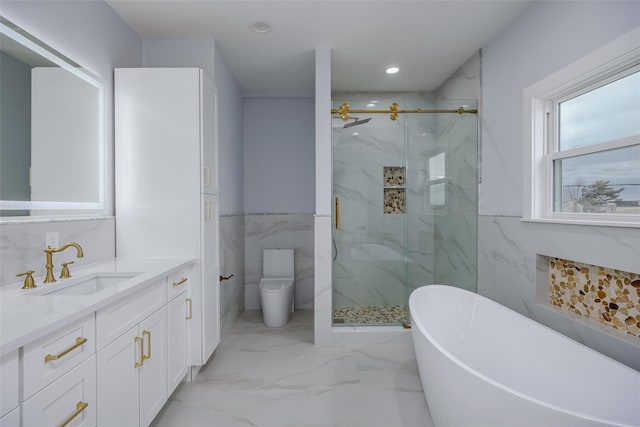 full bathroom with marble finish floor, toilet, vanity, and a marble finish shower