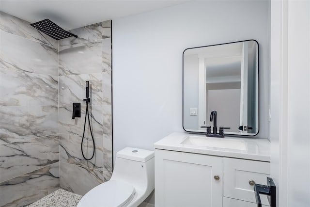 full bathroom featuring vanity, a marble finish shower, and toilet