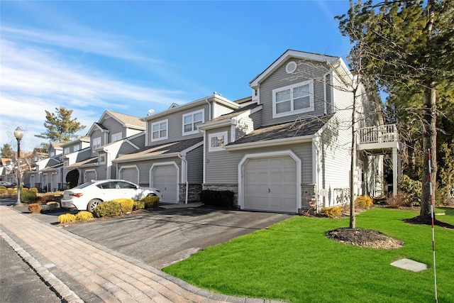 view of front facade with a front lawn and a garage