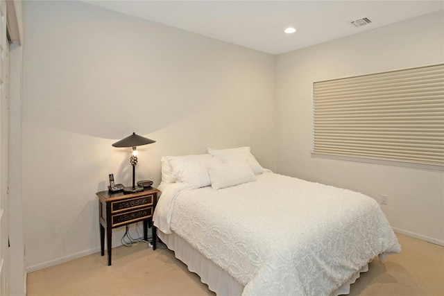 bedroom with light carpet