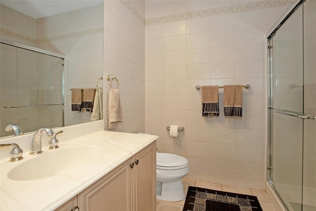 bathroom with tile walls, an enclosed shower, tile patterned flooring, and toilet