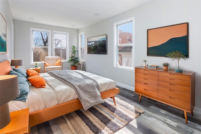 bedroom with hardwood / wood-style flooring