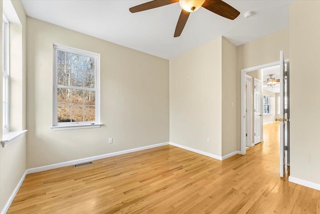 empty room featuring light hardwood / wood-style floors and ceiling fan