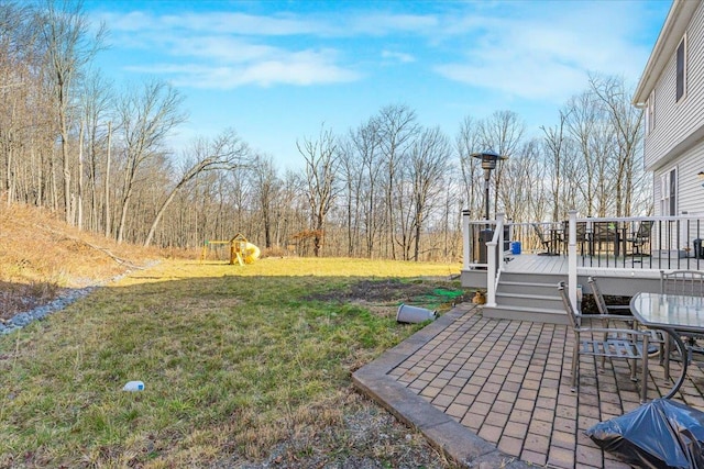 view of yard featuring a wooden deck