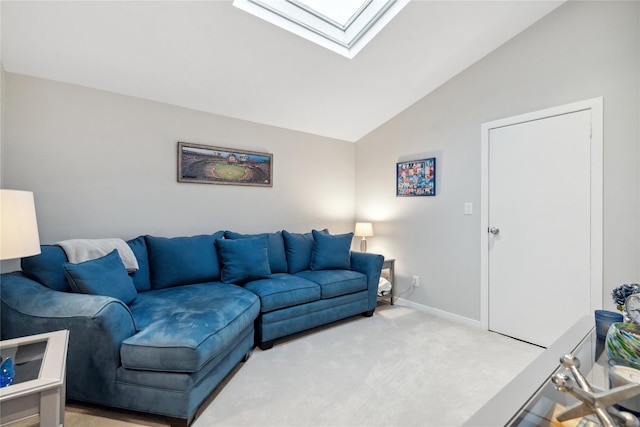 living room with vaulted ceiling with skylight and carpet floors