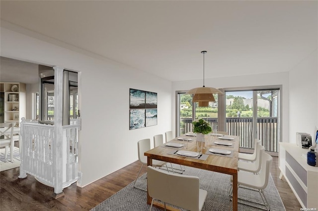 dining room with dark hardwood / wood-style floors