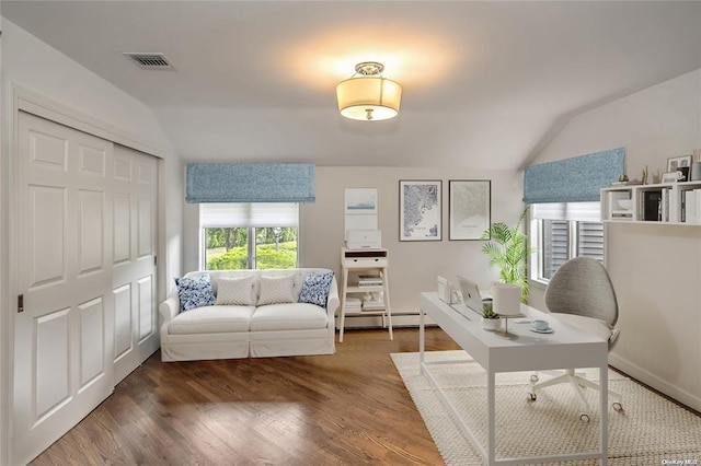 home office with dark hardwood / wood-style floors, a baseboard heating unit, and vaulted ceiling