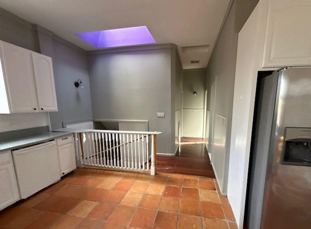 hall featuring light tile patterned floors