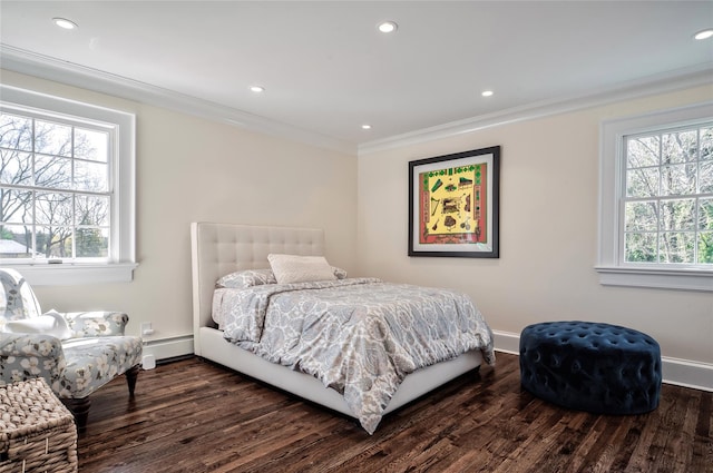 bedroom featuring multiple windows, ornamental molding, and a baseboard heating unit