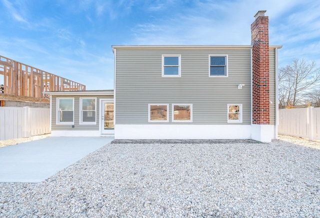 back of property featuring a patio