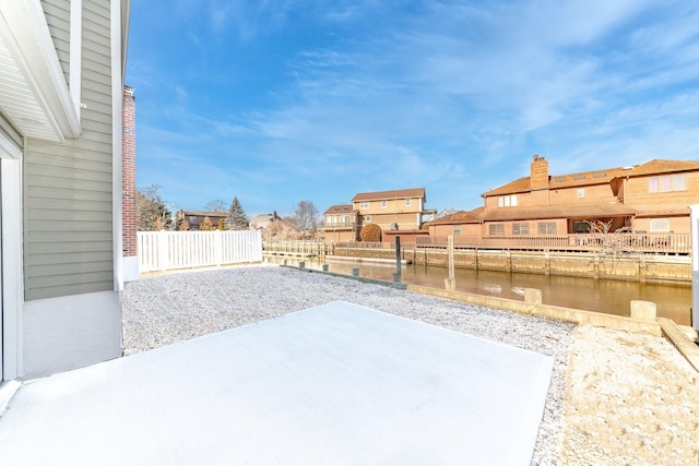 view of yard featuring a patio area and a water view