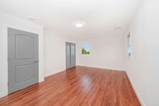 spare room with light hardwood / wood-style flooring