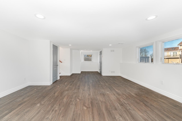 empty room featuring dark hardwood / wood-style flooring